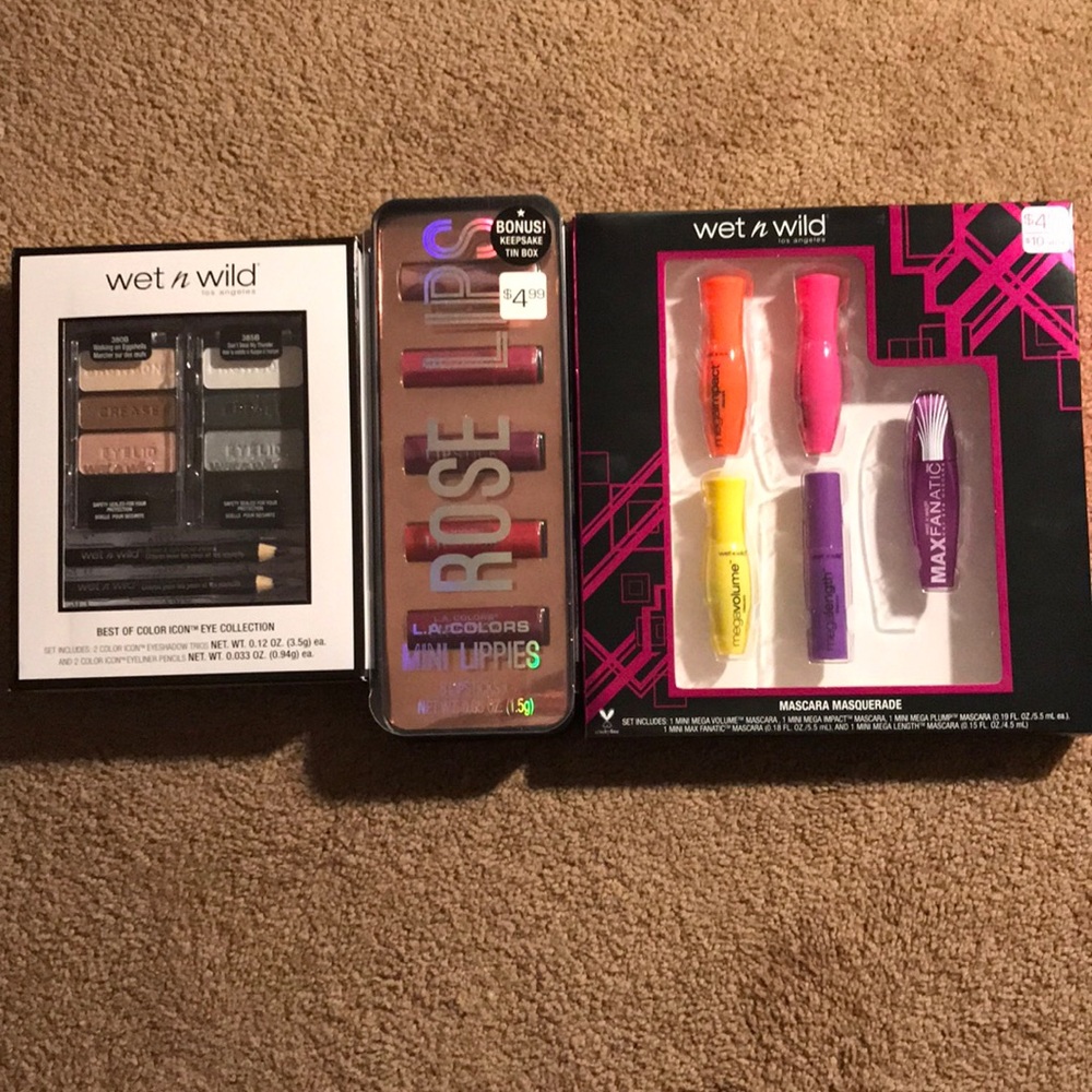 Mascara, eye shadow, eye liner, and lip gloss.